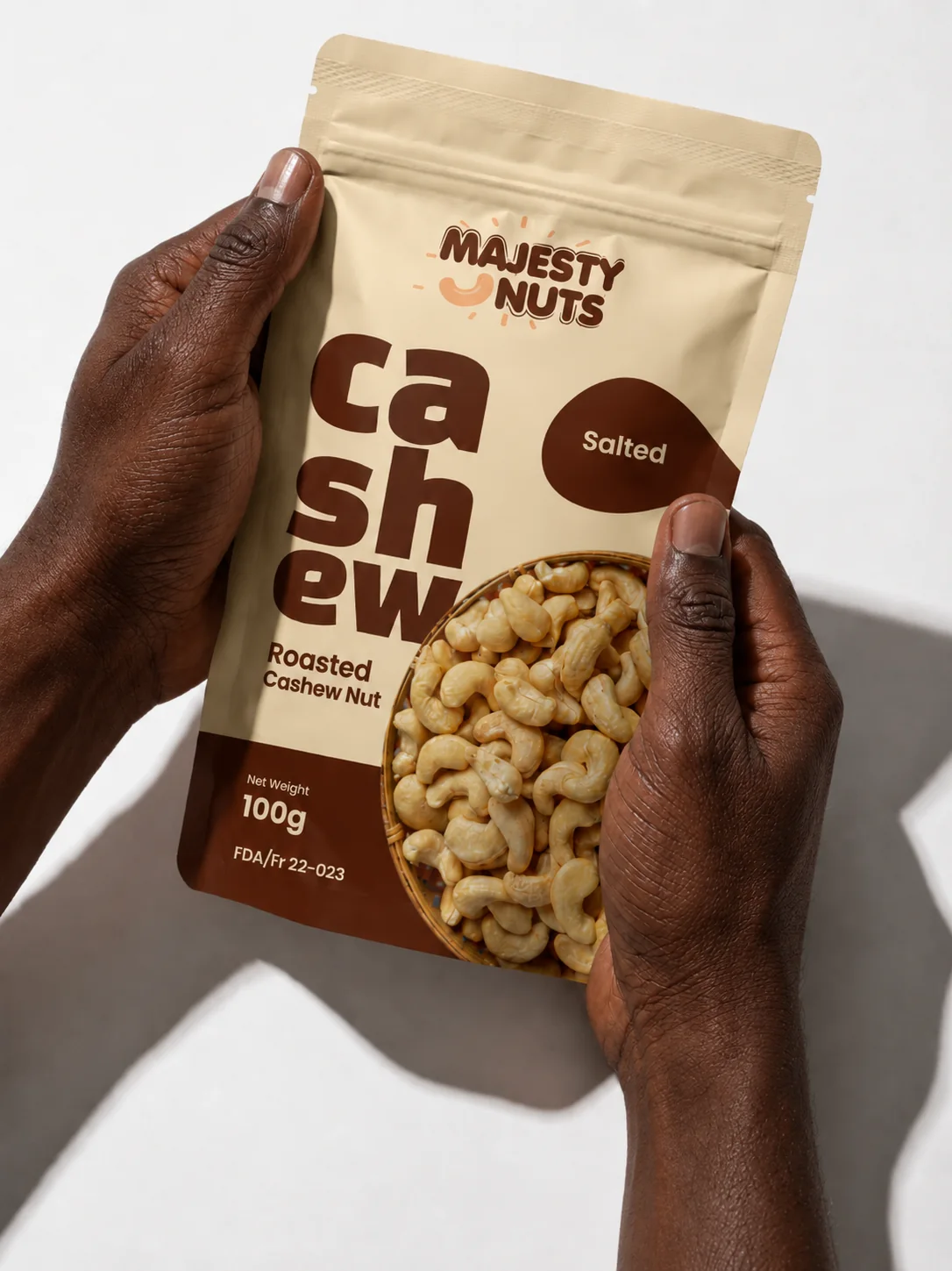 MajestyNuts salted roasted cashews held in two hands
